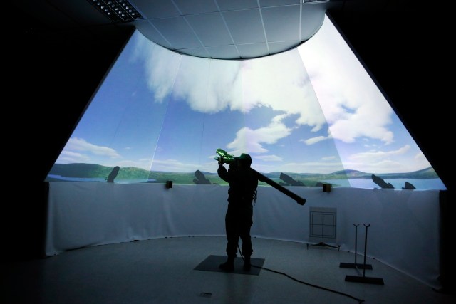 A Venezuelan soldier practices on an anti-aircraft artillery simulator as part of a defensive military exercise in conjunction with the general public in Caracas