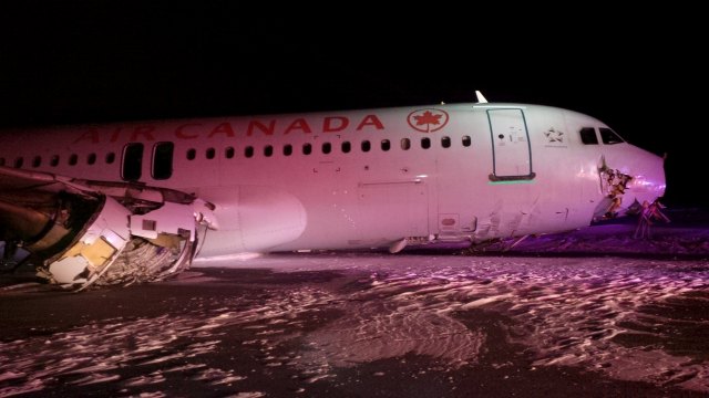 An Air Canada Airbus A-320 lies in the snow after it skidded off the runway at Halifax International Airport
