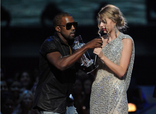 NEW YORK - SEPTEMBER 13:  Kanye West (L) jumps onstage after Taylor Swift (C) won the "Best Female Video" award during the 2009 MTV Video Music Awards at Radio City Music Hall on September 13, 2009 in New York City.  (Photo by Jeff Kravitz/FilmMagic)
