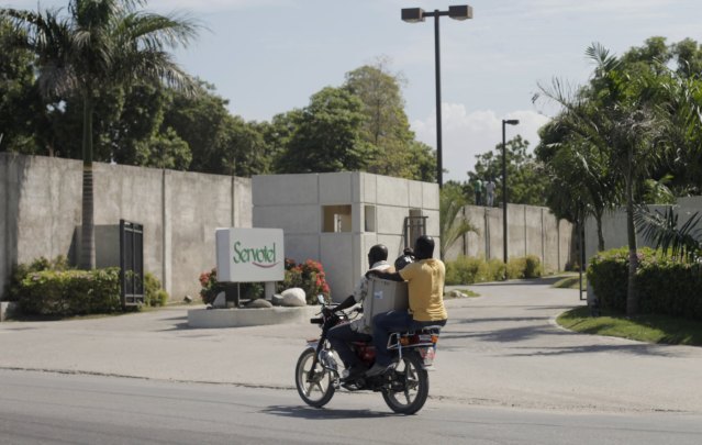 Men on a motorcycle pass the entrance of Servotel hotel, where two of Venezuelan President Nicolas Maduro's relatives were arrested for cocaine smuggling, in Port-au-Prince, Haiti, November 12, 2015. The two nephews of Maduro's wife, Cilia Flores, have been indicted in the U.S. for cocaine smuggling, according to court papers on Thursday, following an international sting that Venezuela cast as an "imperialist" attack. The two were arrested at Servotel hotel in the Haitian capital, Port-au-Prince, on Tuesday by anti-narcotics police at the request of U.S. authorities, according to a senior Haitian official. REUTERS/Andres Martinez Casares    FOR EDITORIAL USE ONLY. NO RESALES. NO ARCHIVE.