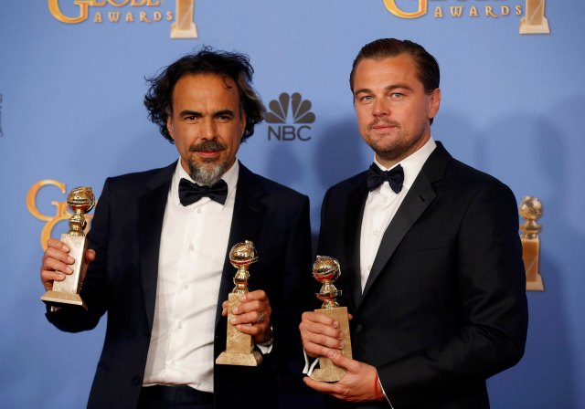 Director Alejandro Gonzalez Inarritu poses with the awards for Best Director and Best Motion Picture - Drama for "The Revenant" (L) and actor Leonardo DiCaprio poses with the award for Best Performance by an Actor in a Motion Picture - Drama for  "The Revenant" during the 73rd Golden Globe Awards in Beverly Hills, California January 10, 2016.  REUTERS/Lucy Nicholson