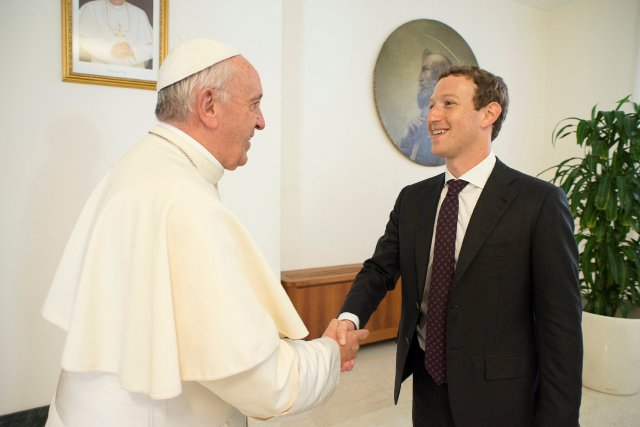 Pope Francis shakes hands with Facebook CEO Mark Zuckerberg during a meeting at the Vatican August 29, 2016. Osservatore Romano/Handout via Reuters ATTENTION EDITORS - THIS IMAGE WAS PROVIDED BY A THIRD PARTY. EDITORIAL USE ONLY. NO RESALES. NO ARCHIVE.