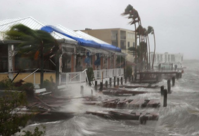 COCOA BEACH, FL - OCTOBER 07: Heavy waves caused by Hurricane Matthew pounds the boat docks at the Sunset Bar and Grill, October 7, 2016 on Cocoa Beach, Florida. Hurricane Matthew passed by offshore as a catagory 3 hurricane bringing heavy winds and minor flooding.   Mark Wilson/Getty Images/AFP