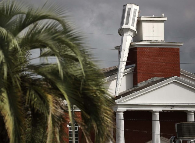 JACKSONVILLE, FL - OCTOBER 07: The steeple atop of the Morning Glory Christian Church, was toppled over by the strong winds of Hurricane Matthew, October 8, 2016 in Jacksonville, Florida. Across the Southeast, Over 1.4 million people have lost power due to Hurricane Matthew which has been downgraded to a category 1 hurricane on Saturday morning. Mark Wilson/Getty Images/AFP
