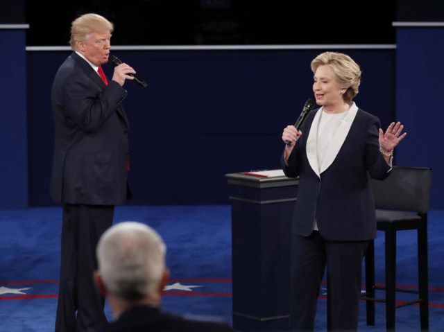 Donald Trump and Hillary Clinton speak. REUTERS/Jim Young
