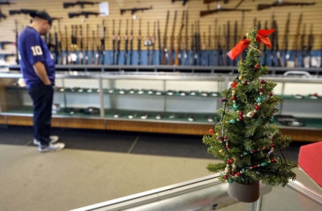 A Christmas tree sits on the counter at the Pony Express Firearms shop in Parker, Colorado December 7, 2015. REUTERS/Rick Wilking/File Photo