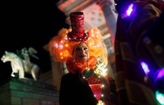 An artist dressed as Puppet Queen poses at the opening of the Christmas market at Gendarmenmarkt square in Berlin, Germany November 21, 2016. REUTERS/Hannibal Hanschke