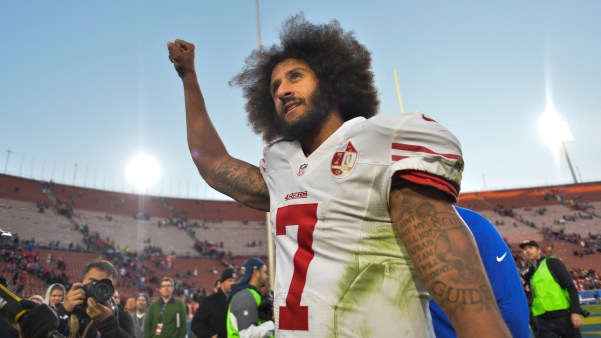Dec 24, 2016; Los Angeles, CA, USA; San Francisco 49ers quarterback Colin Kaepernick (7) pumps his fist as he acknowledges the cheers from the 49ers' fans after leading his team to a 22-21 come-from-behind win over the Los Angeles Rams at Los Angeles Memorial Coliseum. Mandatory Credit: Robert Hanashiro-USA TODAY Sports