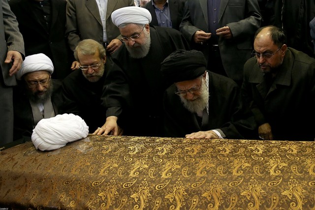 Iran's Supreme Leader Ayatollah Ali Khamenei and Iran's President Hassan Rouhani touch the coffin of former president Ali Akbar Hashemi Rafsanjani during his funeral ceremony in Tehran, Iran January 10, 2017. Leader.ir/Handout via REUTERS ATTENTION EDITORS - THIS IMAGE WAS PROVIDED BY A THIRD PARTY. EDITORIAL USE ONLY. NO RESALES. NO ARCHIVE.