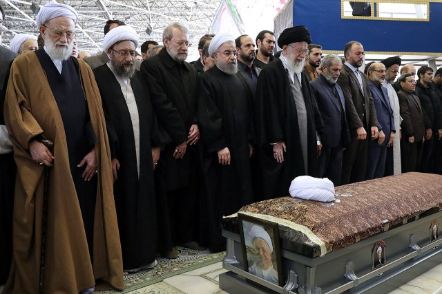 Iran's Supreme Leader Ayatollah Ali Khamenei and Iran's President Hassan Rouhani pray next to the coffin of former president Ali Akbar Hashemi Rafsanjani during his funeral ceremony in Tehran, Iran January 10, 2017. President.ir/Handout via REUTERS ATTENTION EDITORS - THIS PICTURE WAS PROVIDED BY A THIRD PARTY. FOR EDITORIAL USE ONLY. NO RESALES. NO ARCHIVE.