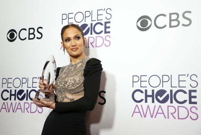 Actress Jennifer Lopez poses backstage with her award for Favorite Crime Drama TV Actress for "Shades of Blue" at the People's Choice Awards 2017 in Los Angeles, California, U.S., January 18, 2017.  REUTERS/Danny Moloshok