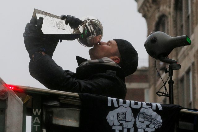 New England Patriots quarterback Tom Brady kisses one of the team's five Vince Lombardi trophies during their victory parade through the streets of Boston after winning Super Bowl LI, in Boston