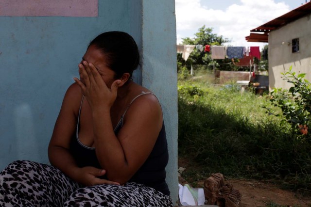 Jennifer Vivas, mother of Eliannys Vivas, who died from diphtheria, cries at the front porch of her home in Pariaguan, Venezuela January 26, 2017. Picture taken January 26, 2017. REUTERS/Marco Bello