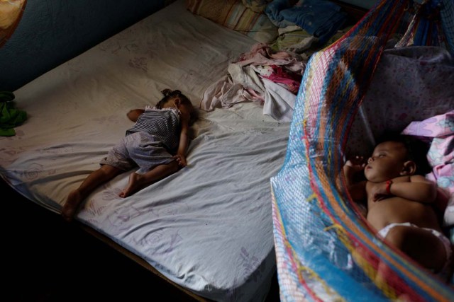 Sisters of Eliannys Vivas, who died from diphtheria, sleep in a room at their home in Pariaguan, Venezuela January 26, 2017. Picture taken January 26, 2017. REUTERS/Marco Bello