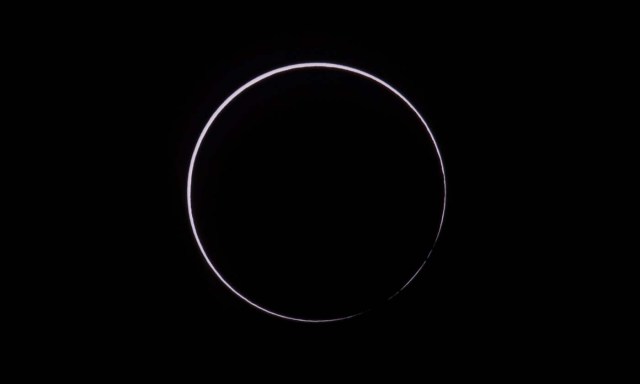 Picture taken on February 26, 2017 showing the moon moving to cover the sun for an annular solar eclipse, as seen from the Estancia El Muster, near Sarmiento, Chubut province, 1600 km south of Buenos Aires, Argentina, on February 26, 2017. Stargazers applauded as they were plunged into darkness Sunday when the moon passed in front of the sun in a spectacular "ring of fire" eclipse. / AFP PHOTO / ALEJANDRO PAGNI