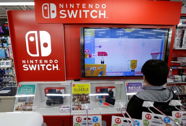 Logos of Nintendo Switch game console are seen at an electronics store in Tokyo, Japan March 3, 2017. REUTERS/Toru Hanai