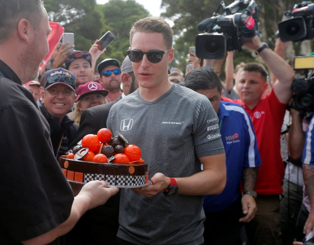 Formula One - F1 - Australian Grand Prix - Melbourne, Australia - 26/03/2017 McLaren driver Stoffel Vandoorne of Belgium is presented with a 25th birthday cake by pastry chef Darren Purchese in Melbourne.  REUTERS/Jason Reed