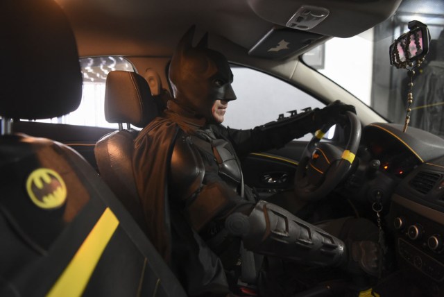 Argentine Batman, powers his 'Batmobile' and heads to the 'Sor Maria Ludovica' children's Hospital in La Plata, 60 kilometres south of Buenos Aires, on June 2, 2017.  The Argentine Batman has made La Plata children's hospital a target of laughter and treats against pain. / AFP PHOTO / Eitan ABRAMOVICH / TO GO WITH AFP STORY BY PAULA BUSTAMANTE MORE PICTURES IN AFPFORUM