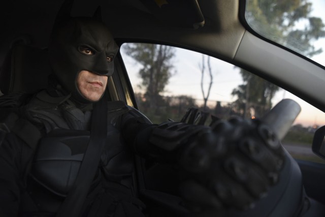 Argentine Batman, powers his 'Batmobile' and heads to the 'Sor Maria Ludovica' children's Hospital in La Plata, 60 kilometres south of Buenos Aires, on June 2, 2017.  The Argentine Batman has made La Plata children's hospital a target of laughter and treats against pain. / AFP PHOTO / Eitan ABRAMOVICH