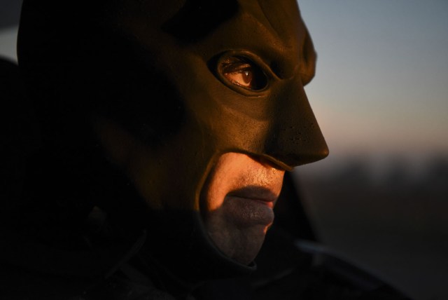 Argentine Batman, powers his 'Batmobile' and heads to the 'Sor Maria Ludovica' children's Hospital in La Plata, 60 kilometres south of Buenos Aires, on June 2, 2017.  The Argentine Batman has made La Plata children's hospital a target of laughter and treats against pain. / AFP PHOTO / Eitan ABRAMOVICH