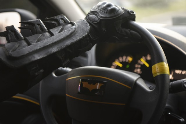 Argentine Batman, powers his 'Batmobile' and heads to the 'Sor Maria Ludovica' children's Hospital in La Plata, 60 kilometres south of Buenos Aires, on June 2, 2017.  The Argentine Batman has made La Plata children's hospital a target of laughter and treats against pain. / AFP PHOTO / Eitan ABRAMOVICH