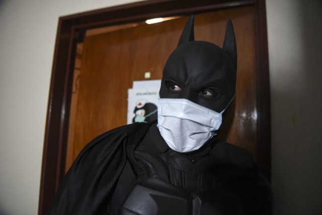 Argentine Batman visits patients under isolation measures at the 'Sor Maria Ludovica' children's Hospital in La Plata, 60 kilometres south of Buenos Aires, on June 2, 2017.  The Argentine Batman has made La Plata children's hospital a target of laughter and treats against pain. / AFP PHOTO / Eitan ABRAMOVICH