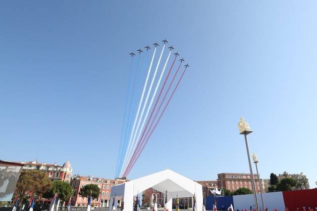 Jets of the Patrouille Acrobatique de France perform during a commemorative ceremony marking the first anniversary of a jihadist truck attack which killed 86 people in Nice, southern France, on Bastille Day, July 14, 2017. Bastille Day celebrations were tinged with mourning, as the Mediterranean city of Nice payed tribute to the victims of an attack claimed by the Islamic State group one year ago, where a man drove a truck into a crowd, killing 86 people.   / AFP PHOTO / Valery HACHE