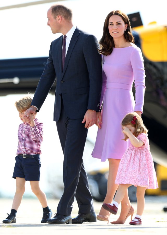 Britain's Prince William, the Duke of Cambridge, his wife Princess Kate, the Duchess of Cambridge, Prince George and Princess Charlotte walk past helicopters at the airfield in Hamburg Finkenwerder, Germany, July 21, 2017. REUTERS/Christian Charisius/POOL