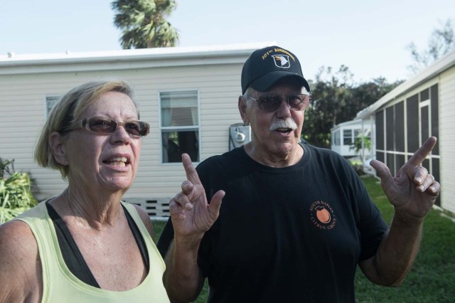 Don and Marie Larcom speak in front of their home at the Enchanted Shores manufactured home park in Naples, Florida, on September 11, 2017 after Hurricane Irma hit Florida. / AFP PHOTO / NICHOLAS KAMM
