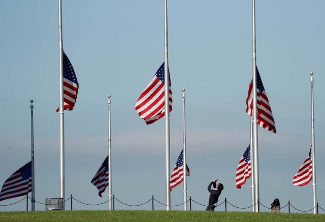 Flags are at half staff to honor those killed and injured in the Las Vegas mass shooting at the Washington Monument in Washington, U.S., October 3, 2017. REUTERS/Kevin Lamarque TPX IMAGES OF THE DAY