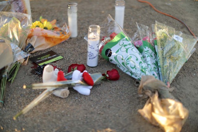 Flowers and candles are seen by site of the Route 91 music festival mass shooting outside the Mandalay Bay Resort and Casino in Las Vegas, Nevada, U.S., October 3, 2017. REUTERS/Lucy Nicholson