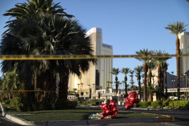 A makeshift memorial is seen next to the site of the Route 91 music festival mass shooting outside the Mandalay Bay Resort and Casino in Las Vegas, Nevada, U.S., October 3, 2017. REUTERS/Lucy Nicholson