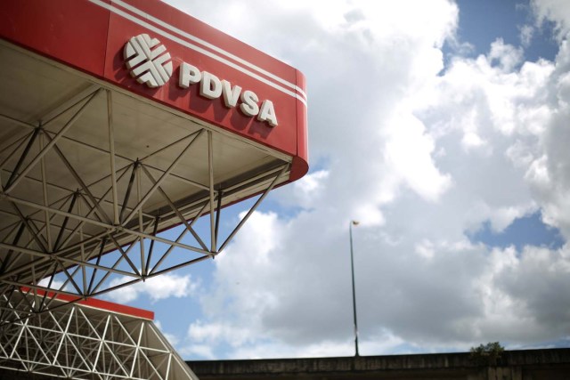 FILE PHOTO: The corporate logo of the state oil company PDVSA is seen at a gas station in Caracas, Venezuela, August 30, 2017. REUTERS/Andres Martinez Casares/File Photo