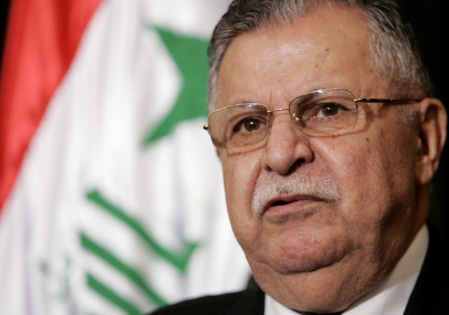 FILE PHOTO: Iraqi President Jalal Talabani speaks at a news conference following his meeting with Director of U.S. Foreign Assistance and USAID Administrator Ambassador Randall L. Tobias in the heavily fortified Green Zone in Baghdad May 25, 2006. REUTERS/Ali Haider/Pool/File Photo