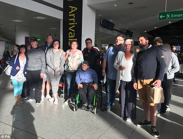 Builder Alan Jee, 42, from Bournemouth, has been saving 'for years' to pay for his £15,000 'love island' wedding with sweetheart Donna Smith, 40, and they were flying to Gran Canaria from Gatwick with 30 loved-ones today (pictured) 