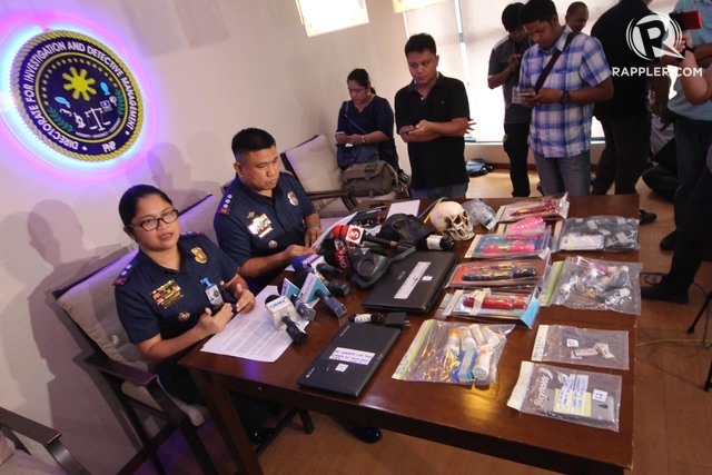 PPSUPT. Villamor Tuliao of PNP-Anti-Trafficking in Person Division (right) and PSUPT. Shiela Portento of Women's and Children Protection Center presents to media to media at Camp Crame on Thursday, the sex toys paraphernalia, laptops and other e-gadgets confiscated from a 58 years old, American Yoga Instructor Robinson Hoyt Alderman upon his arrival at NIA on October 15, 2017. Hoyt was accused of hiring and obtaining a minor for the purpose of pornography and sexual exploitation in violations of the expanded Anti-Human Trafficking Law of the Philippines. Photo by DARREN LANGIT