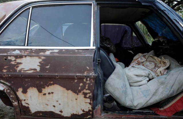 The bed of Eduardo Liendo, 63, who lives inside an old car is pictured on the outskirts of Caracas, Venezuela, October 13, 2017. REUTERS/Ricardo Moraes SEARCH "MORAES GAMBLING" FOR THIS STORY. SEARCH "WIDER IMAGE" FOR ALL STORIES.