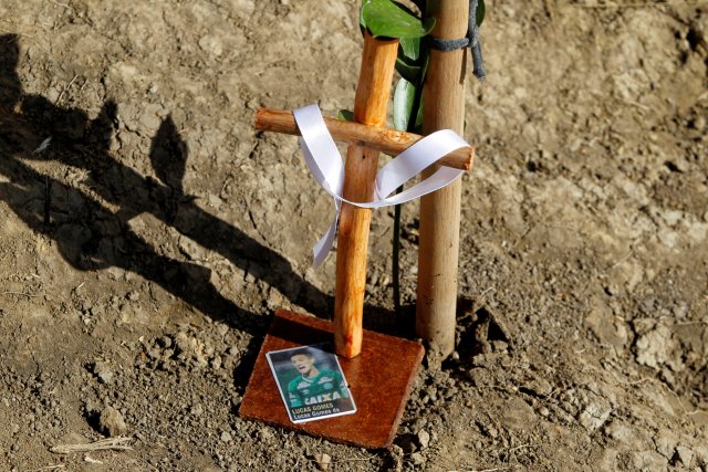 A cross is seen as people pay tribute on the first anniversary of the plane crash where several players of the Chapecoense soccer team died, in La Union, Colombia November 28, 2017. REUTERS/Fredy Builes