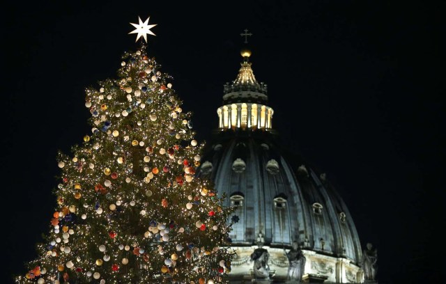 The Vatican Christmas tree is lit up after a ceremony in Saint Peter's Square at the Vatican, December 7, 2017. REUTERS/Alessandro Bianchi