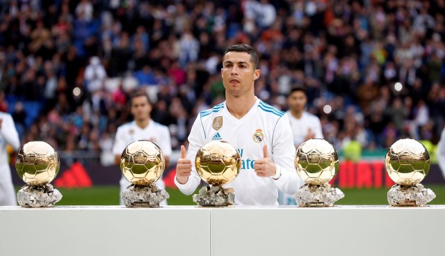 Soccer Football - La Liga Santander - Real Madrid vs Sevilla - Santiago Bernabeu, Madrid, Spain - December 9, 2017 Real Madrid’s Cristiano Ronaldo with his five Ballon d'Or trophies before the match REUTERS/Javier Barbancho