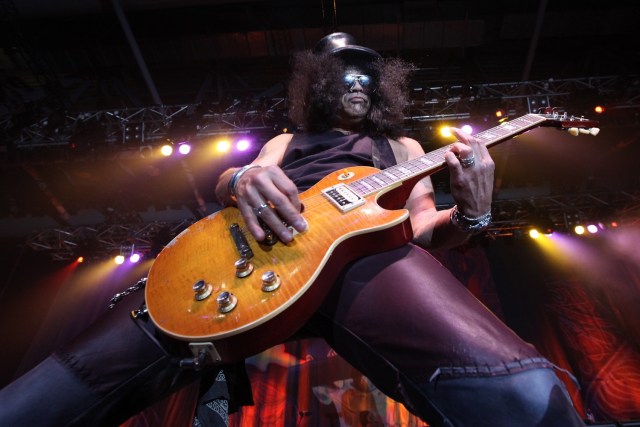 (FILES) This file photo taken on July 29, 2010 shows British-born guitarist Slash performing in Hong Kong. The two-decades-in-the-making reunion of Guns N' Roses has become the fourth highest-earning tour in history, grossing $475 million, Billboard reported on January 4, 2018.The music industry magazine and chart-keeper, releasing its year-end calculations of concert receipts, said that Guns N' Roses had surpassed former Pink Floyd member Roger Waters' marathon 2010-13 "The Wall Live" tour.  / AFP PHOTO / Ed JONES
