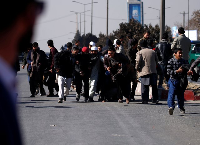 People escape during an attack on the Intercontinental Hotel in Kabul, Afghanistan January 21, 2018. REUTERS/Mohammad Ismail