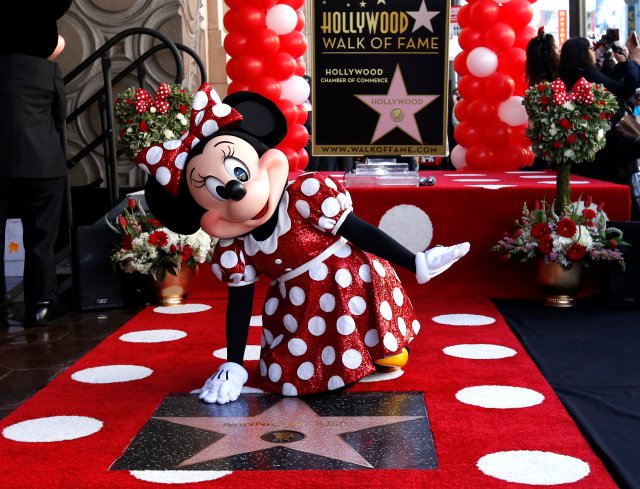 The character of Minnie Mouse poses on her star after it was unveiled on the Hollywood Walk of Fame in Los Angeles, California, U.S., January 22, 2018. REUTERS/Mario Anzuoni