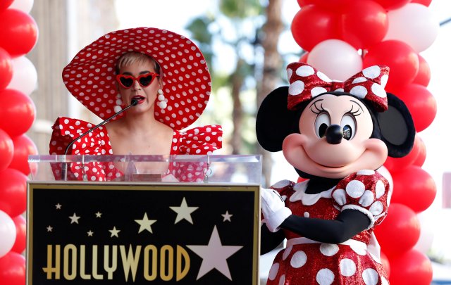 Singer Katy Perry speaks next to the character of Minnie Mouse at the unveiling of her star on the Hollywood Walk of Fame in Los Angeles, California, U.S., January 22, 2018. REUTERS/Mario Anzuoni