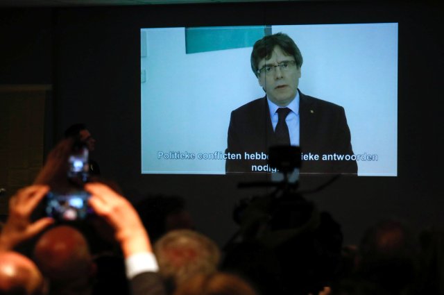 Former Catalan President Carles Puigdemont appears on a screen as he delivers a speech during the new year's party of Leuven city local section of Belgium's nationalist party NV-A, in Leuven, Belgium, January 30, 2018. REUTERS/Yves Herman
