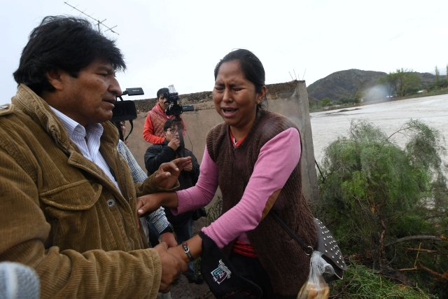 A woman cries as she shakes hands with Bolivia's President Evo Morales in Tupiza after heavy rains caused floods, Tupiza, Potosi, Bolivia, January 2, 2018. Picture taken in January 2, 2018 Reynaldo Zaconeta/Courtesy of Bolivian Presidency/Handout via REUTERS    ATTENTION EDITORS - THIS IMAGE WAS PROVIDED BY A THIRD PARTY.