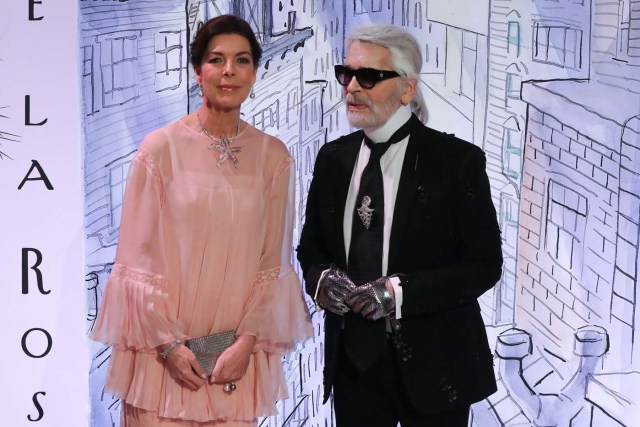 Caroline of Monaco, Princess of Hanover (L) and German fashion designer Karl Lagerfeld pose upon their arrival for the annual Rose Ball at the Monte-Carlo Sporting Club in Monaco, on March 24, 2018. The Rose Ball is one of the major charity events in Monaco. Created in 1954, it benefits the Princess Grace Foundation. / AFP PHOTO / POOL / VALERY HACHE