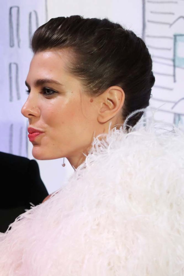 Charlotte Casiraghi poses upon their arrival for the annual Rose Ball at the Monte-Carlo Sporting Club in Monaco, on March 24, 2018. The Rose Ball is one of the major charity events in Monaco. Created in 1954, it benefits the Princess Grace Foundation. / AFP PHOTO / POOL / VALERY HACHE