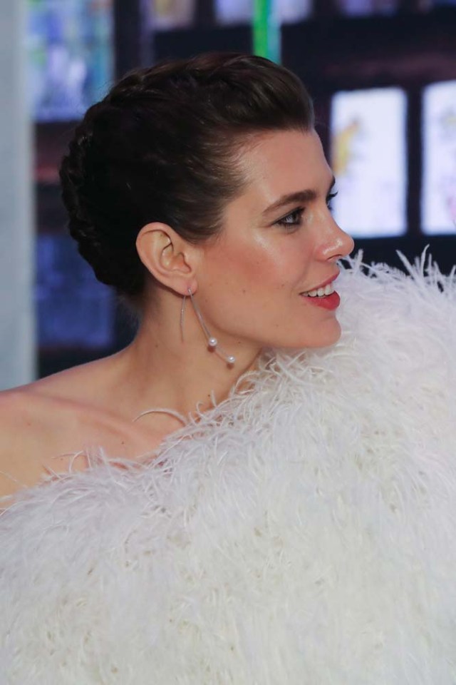 Charlotte Casiraghi arrives for the annual Rose Ball at the Monte-Carlo Sporting Club in Monaco, on March 24, 2018. The Rose Ball is one of the major charity events in Monaco. Created in 1954, it benefits the Princess Grace Foundation. / AFP PHOTO / POOL / VALERY HACHE