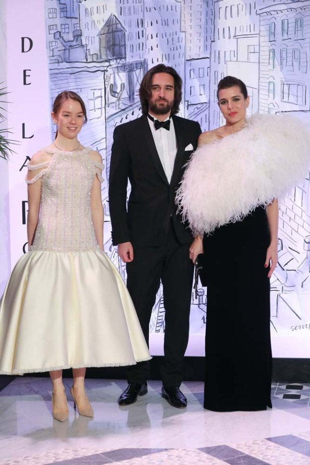 Charlotte Casiraghi (R) and her partner Dimitri Rassam (C) and Princess Alexandra of Hanover (L) pose upon their arrival for the annual Rose Ball at the Monte-Carlo Sporting Club in Monaco, on March 24, 2018. The Rose Ball is one of the major charity events in Monaco. Created in 1954, it benefits the Princess Grace Foundation. / AFP PHOTO / POOL / VALERY HACHE